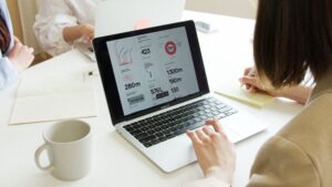Business meeting featuring laptops, 吹奏楽を通した国際交流の調整